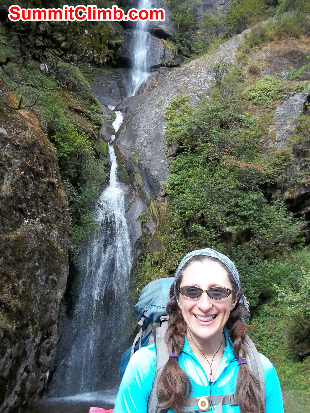 Pamela posing behind water fall in Taktak
