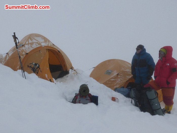 Preparing to pack up camp 3 and descend in a blizzard after summiting. Juergen Landmann Photo