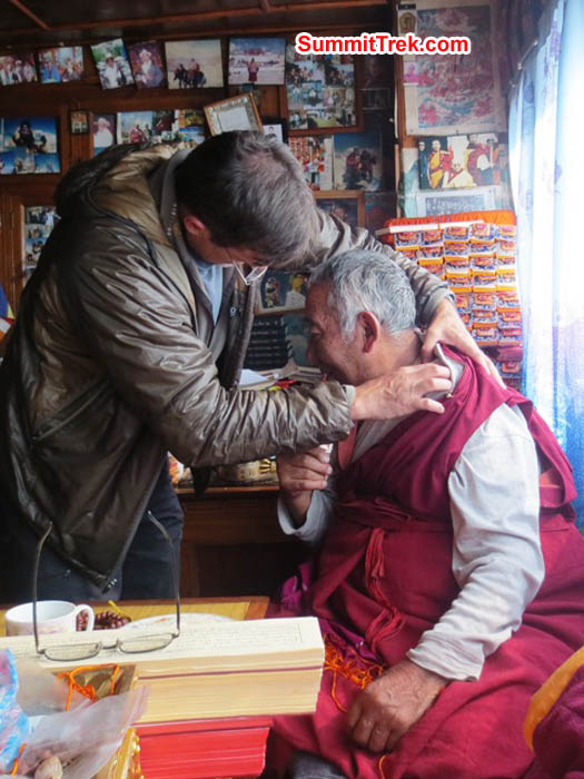 Doctor Brian Rolfson examines Lama Geshe in his home in Pangboche. Hannah Rolfson Photo.