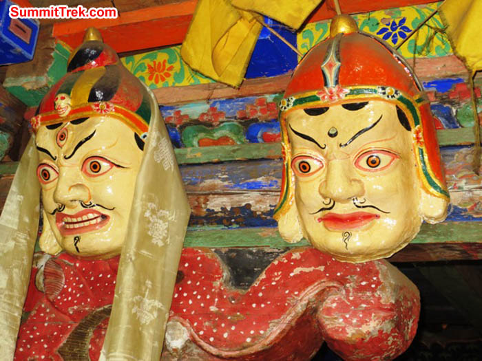 Scary masks and a carved beam support in Pangboche Gompa. Hannah Rolfson Photo