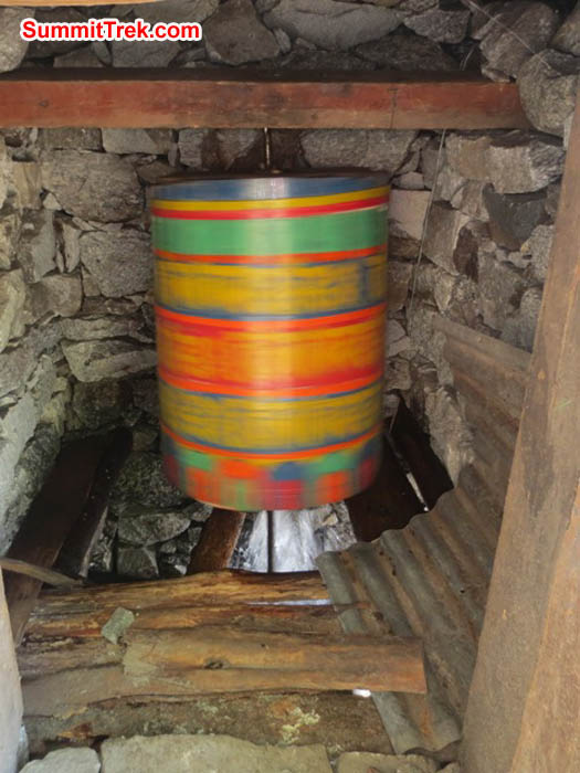 Water powered prayer wheel spins rapidly inside its little house in Fungki Thangka village. Hannah Rolfson Photo.