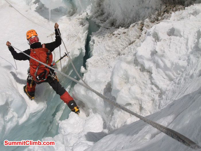 Monika Witkowska jumps a crevasse in the icefall. Violetta Pontinen Photo