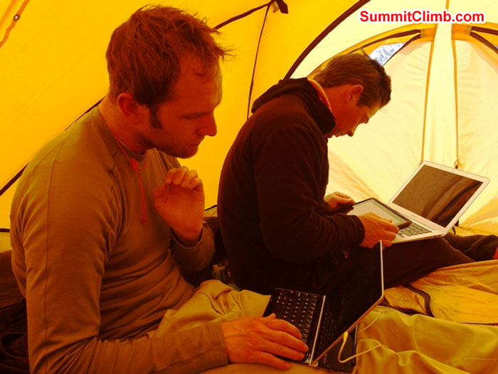 Steve Pearson and Dave Roskelley, checking email surfing the net at the 3g spot in basecamp. Monika Witkowska Photo