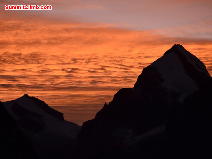 Golden sunset over Triputi Peaks, as seen from Kare Village. Photo by Michael Moritz.