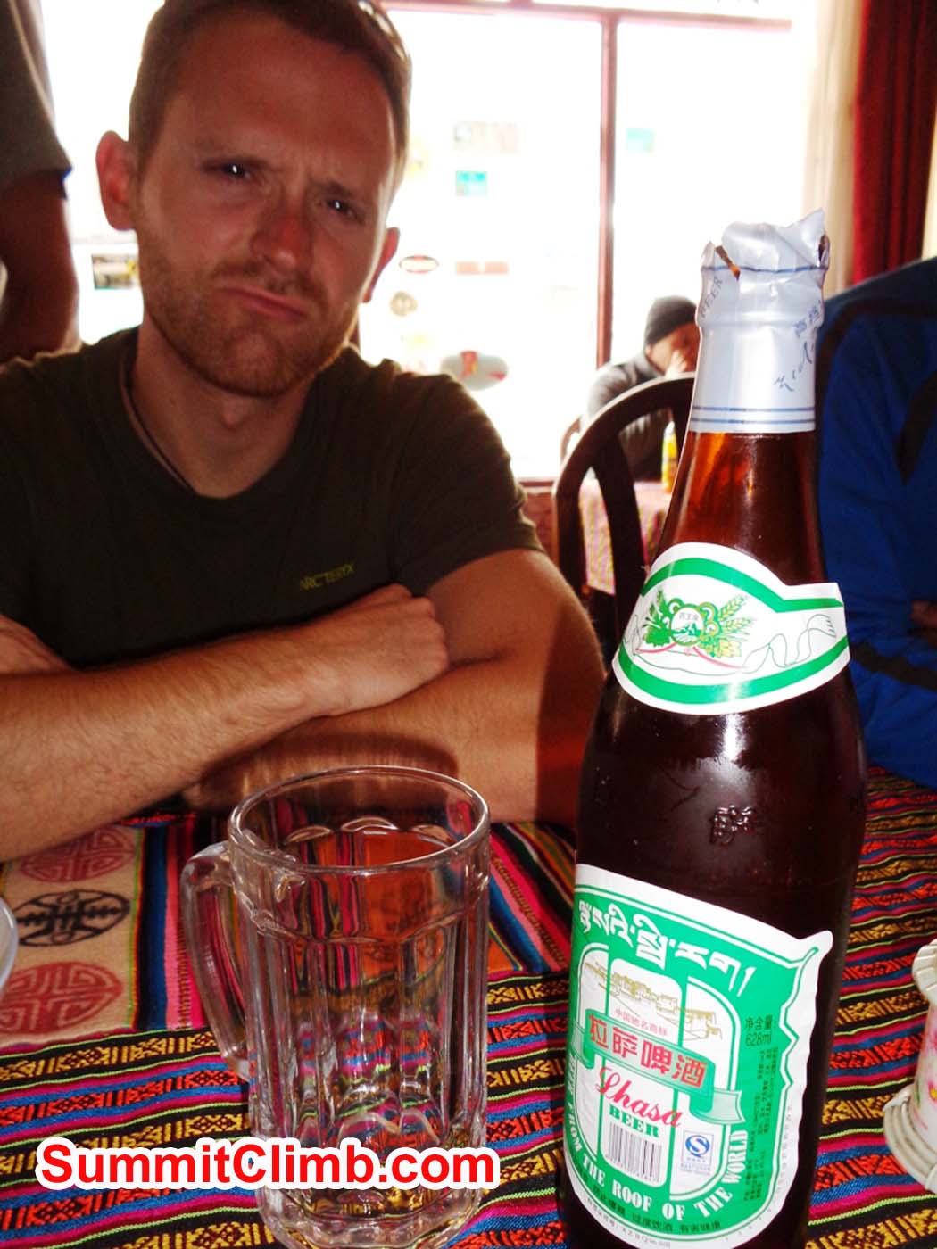 Jan 'enjoys' the first Lhasa beer after entering Tibet. Sacha Guittet photo