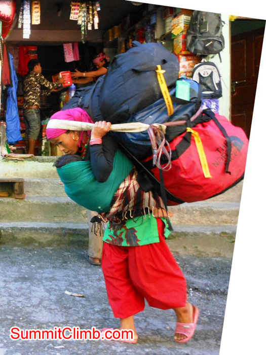 Porter carrying loads across the Nepal Tibet border. Stu Frink photo