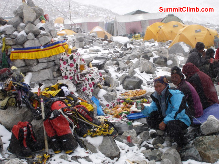 Puja blessing ceremony in advanced basecamp during a snow storm. Climbing gear gets blessed too. Thats Jangbu Sherpa sitting beside the Lama and Dan. Ang Pasang Photo
