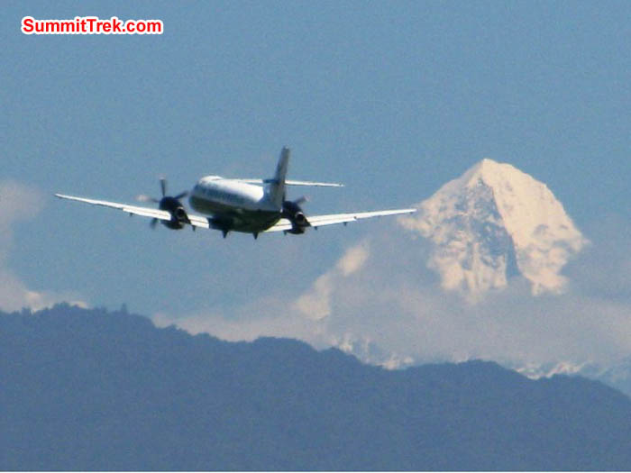 Plane takes off from the Kathmandu airport in front of Mount Ganesh. Keith Bailey Photo