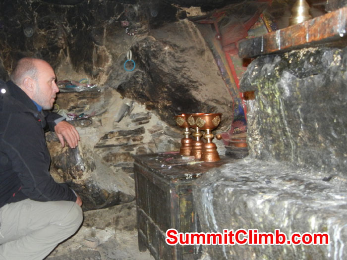 Garry inside cave at Ancient Rongbuk Monestery asking Mt Chomolungma for safe passage - Photo Scott Patch