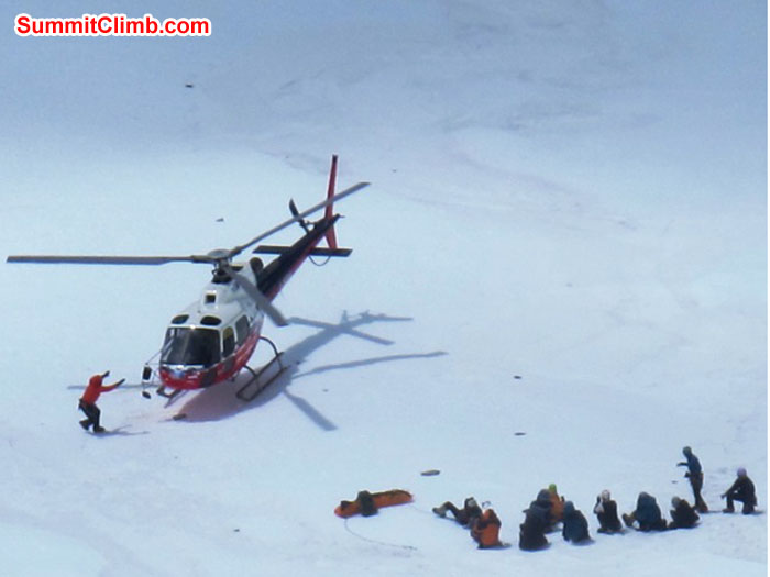 Rescue helicopter in camp 2. Victim lies on stretcher. Photo taken with respect by Monika Witkowska