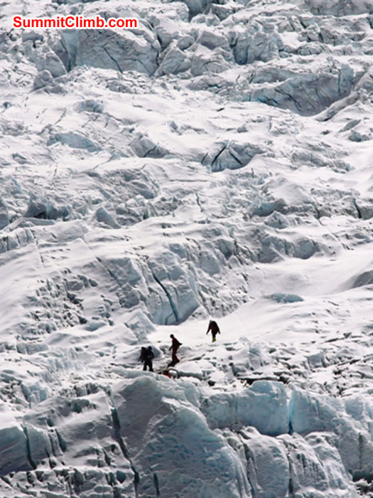 Tiny team walking in the giant icefall. Monika Witkowska Photo