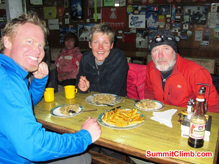 Scott Smith, Monika Witkowska, and Kieran Lally enjoying a delicious dinner in Lobuche. Photo by Slavo.