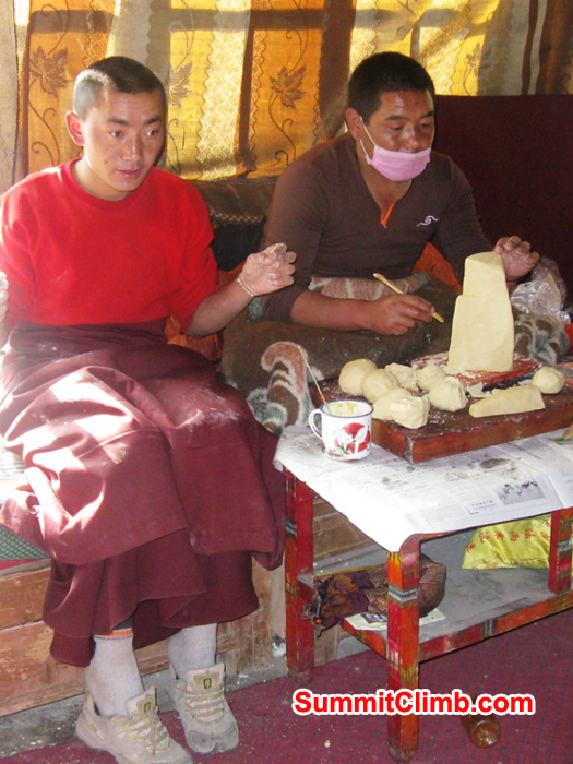 Monks in the Rongbuk Monastery carving butter sculptures