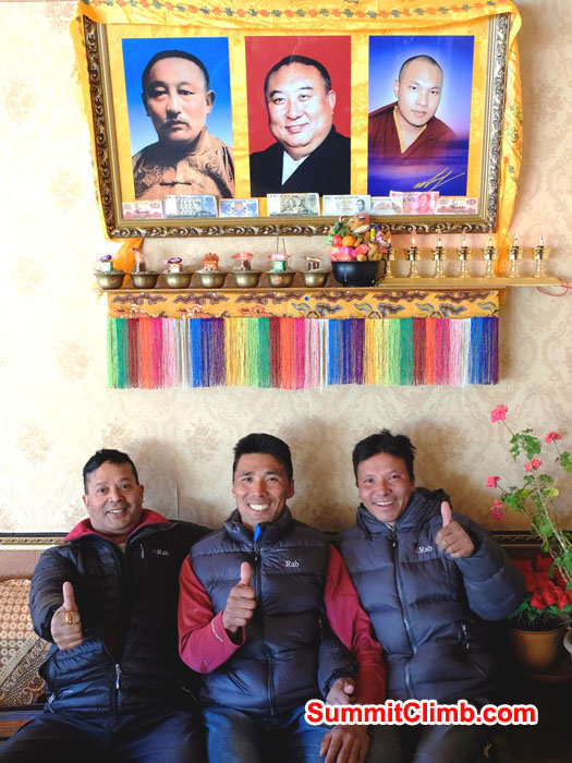 Murari, Dorje, and Tenji Sherpa in Tingri, Tibet with RAB jackets and 3 lamas.