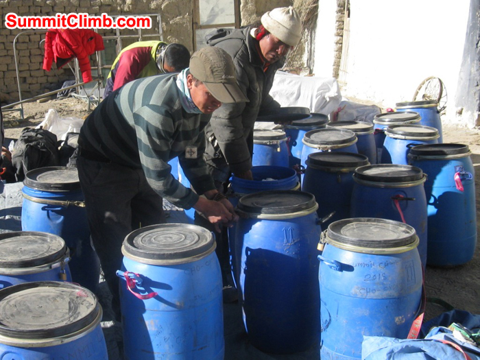 ../../images/Everest/Tenji Dorje and Chimi sorting out our Cho Oyu and Shishapangma storage drums.JPG