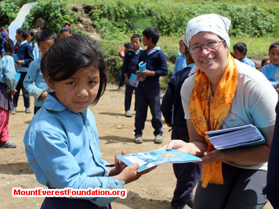nepal volunteer trek, student receving donation