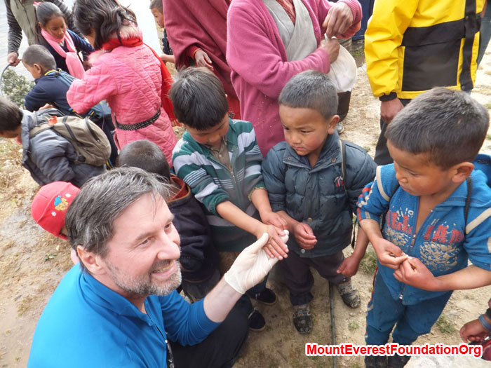 Wolfgang Nicola shows Dhorkharka students how to wash their hands. Photo by Dan Mazur